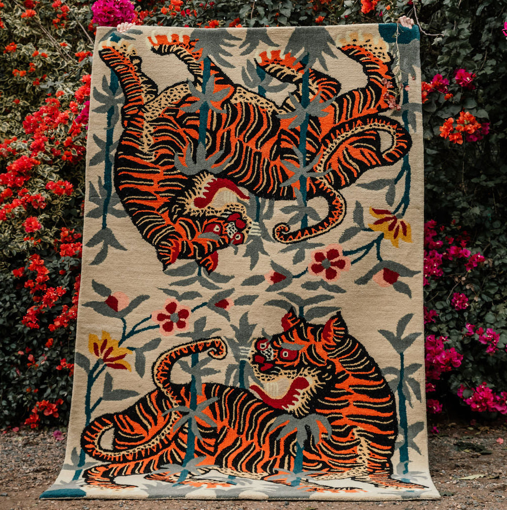 A hand-tufted wool rug featuring a Tibetan Tiger print