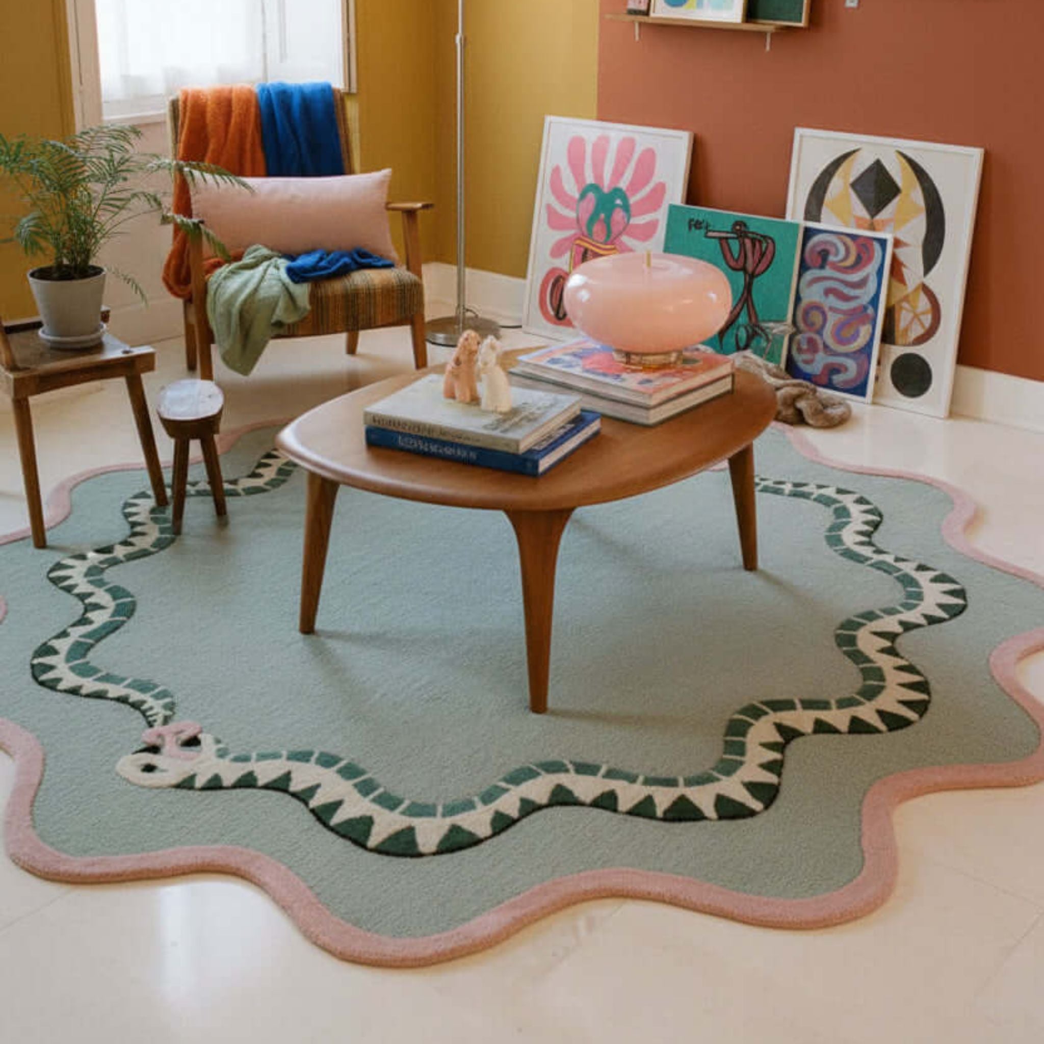 Living rooom with a green and pink wool snake patterned statement rug in South Africa 