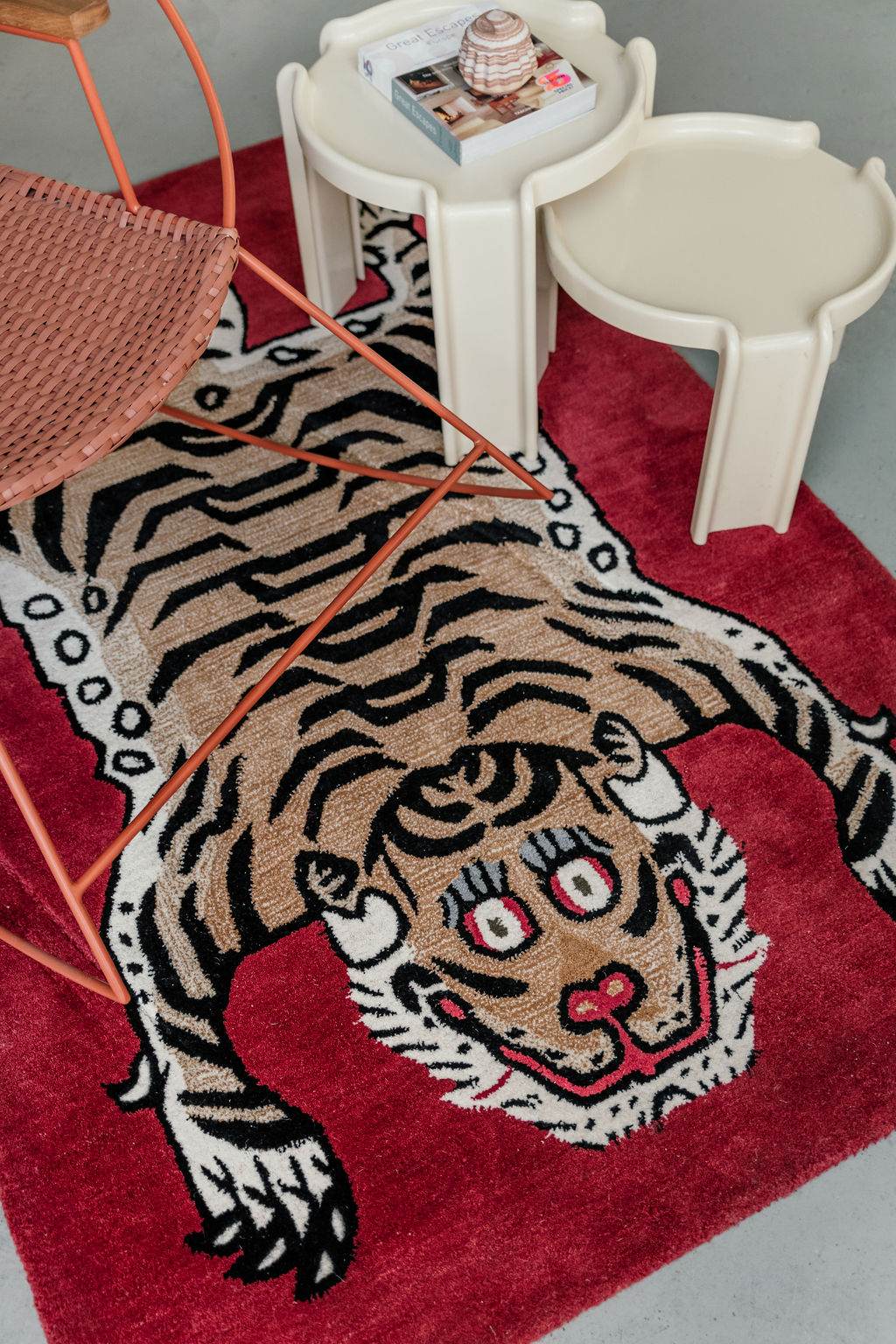 Maroon Tiger rug on a floor with a small table and chair in the background. kids room south africa