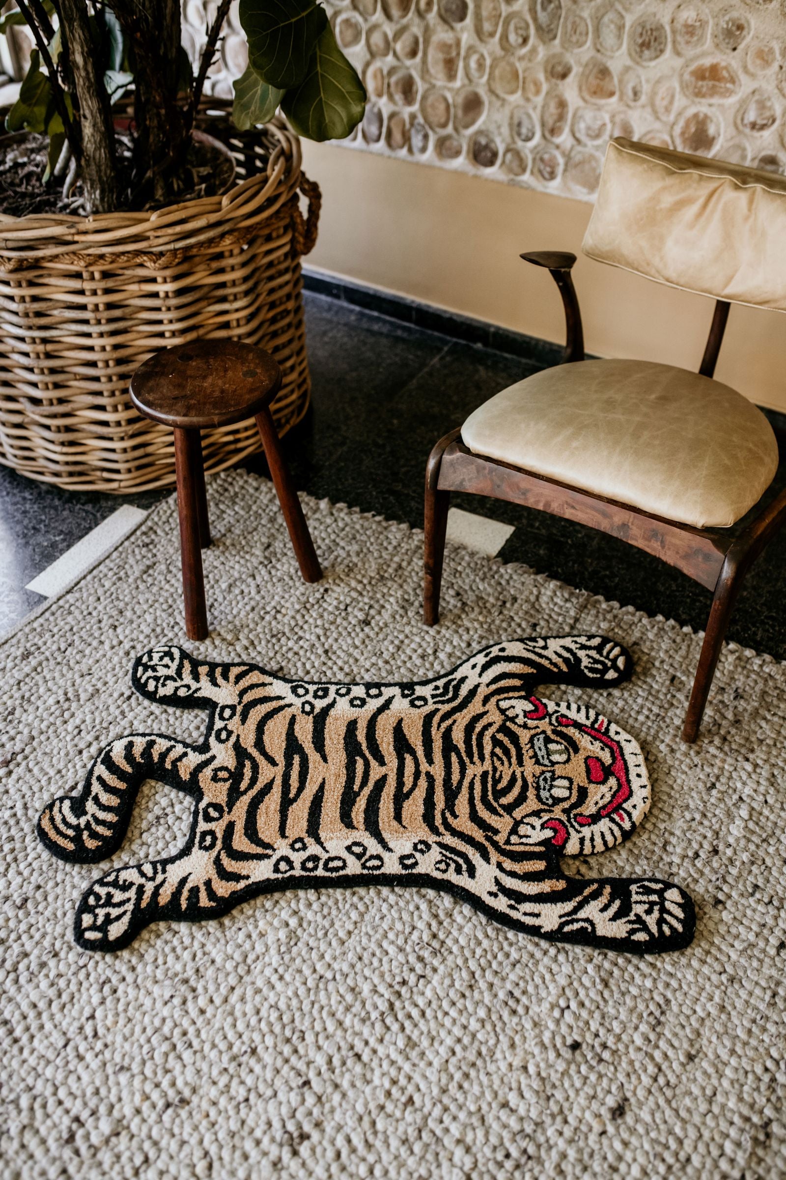 Tiger rug laying on a carpet