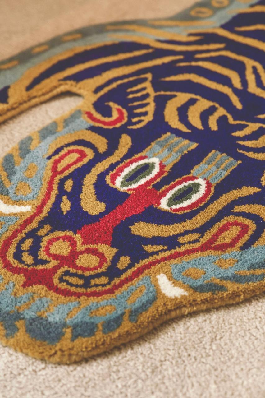 Close-up of a colorful tibetan tiger design on a wool rug. south africa