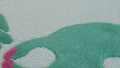 shoes walking across a blue and green wool statement rug in south africa